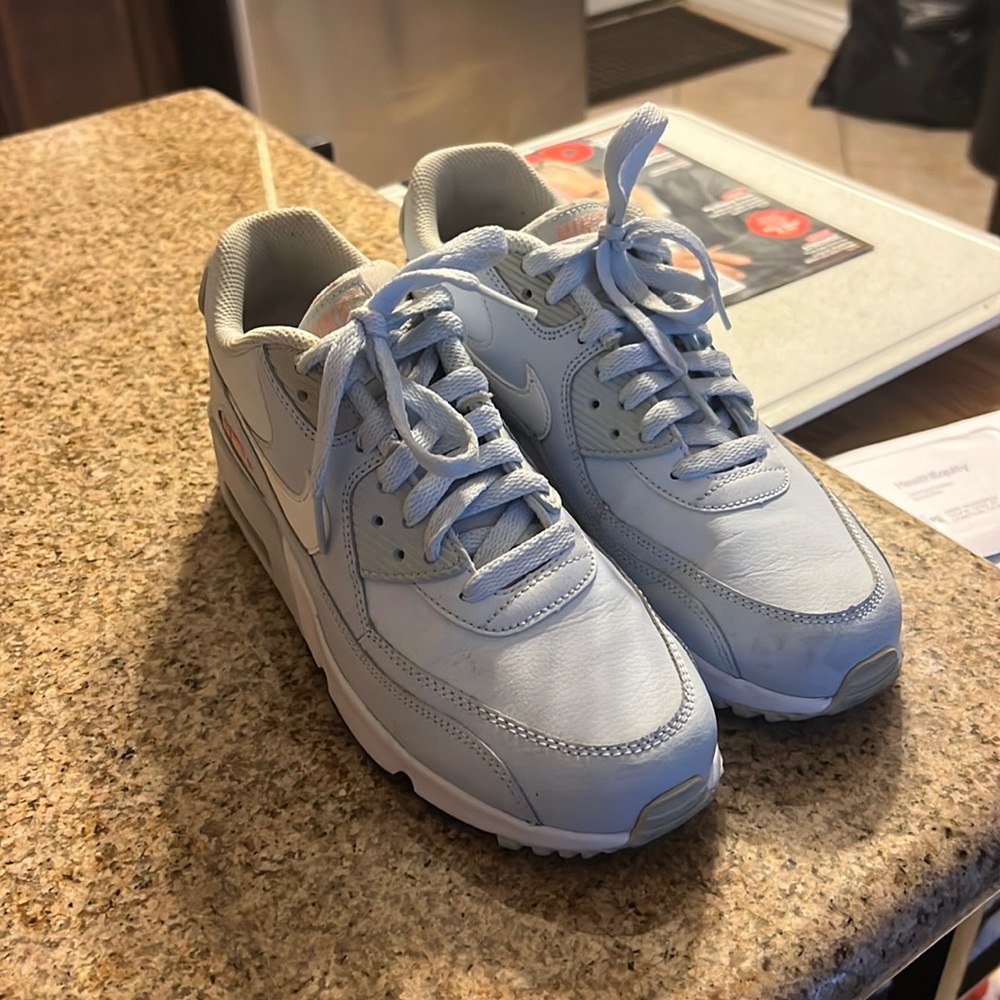 Blue, white and a corral color nike air max